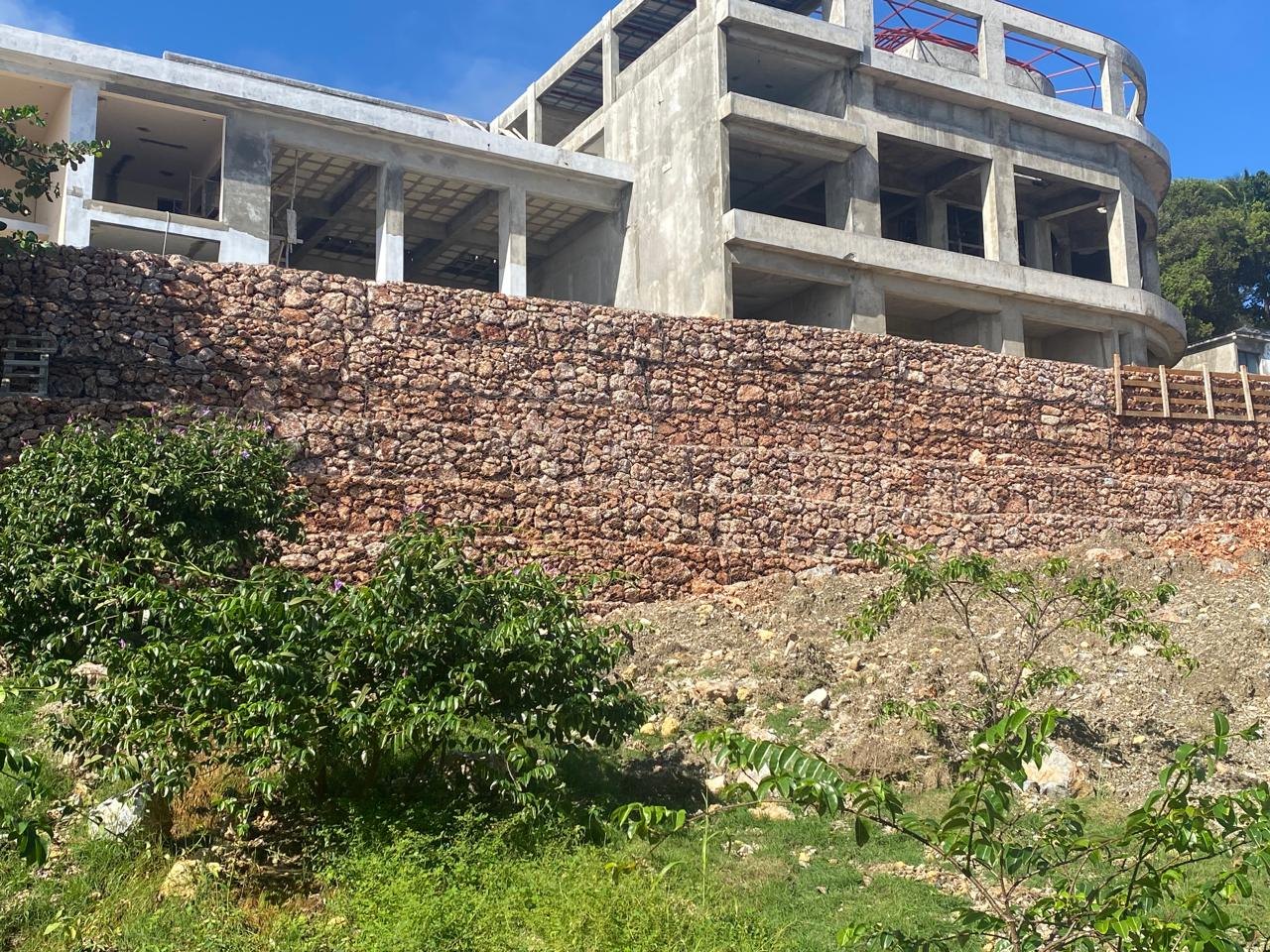 Concrete frame and stone retaining wall